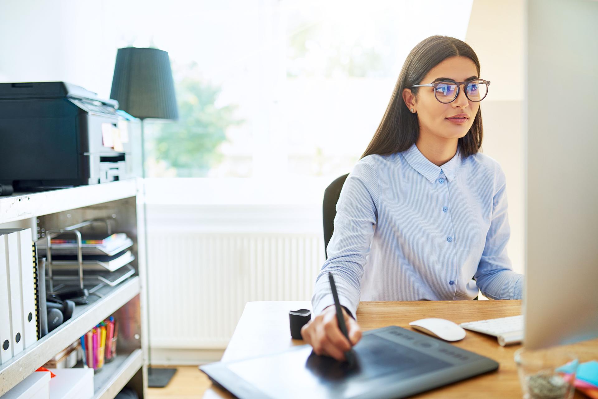 Young businesswoman working in a design studio