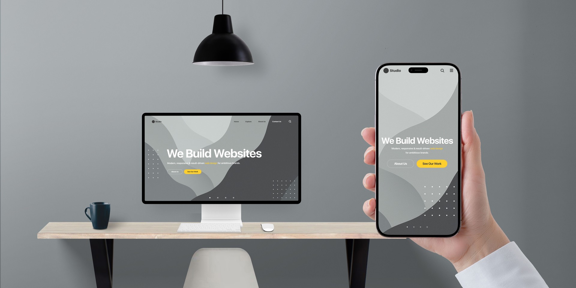 Digital transformation concept with responsive business website shown on phone and desktop display, hand holding device in modern office